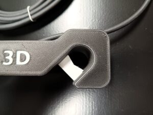 Detaljbild på hängande montering av statuslampa: Upphängning med låsdetalj